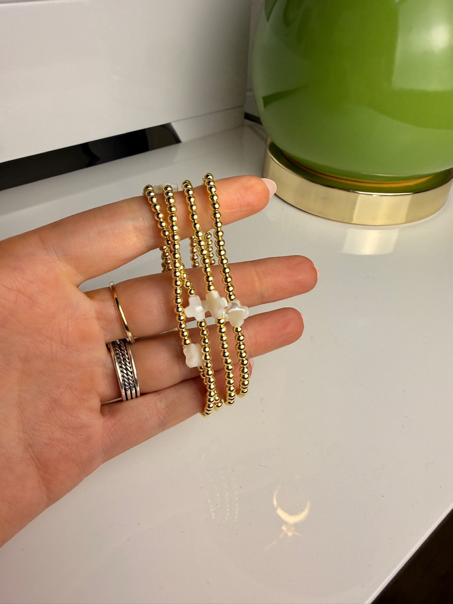 jennifer thames gold beaded bracelet with pearl cross