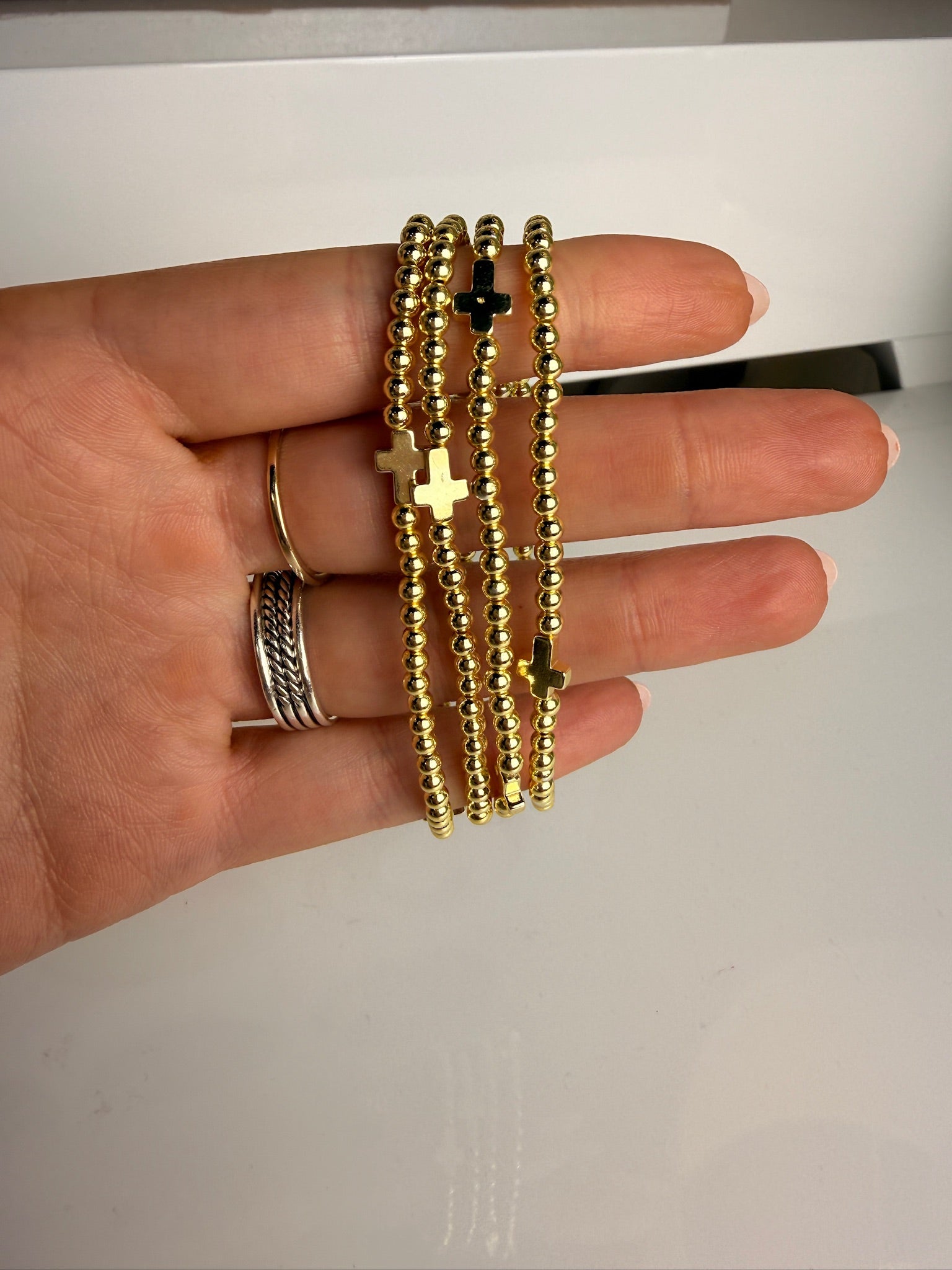 jennifer thames gold beaded bracelet with gold cross